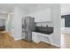 Kitchen area featuring stainless steel refrigerator, custom cabinets, and stylish countertops at 9703 Fortune Dr, Fishers, IN 46037