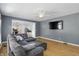 Spacious living room boasting hardwood floors and views of the adjoining kitchen at 9703 Fortune Dr, Fishers, IN 46037