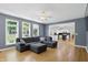 Open living space showcasing hardwood floors and open access to the connected kitchen at 9703 Fortune Dr, Fishers, IN 46037