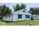 Single-story home with white siding and an attached garage at 9925 Catalina Dr, Indianapolis, IN 46235