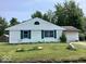 Single-story home showcasing classic white siding and green shutters at 9925 Catalina Dr, Indianapolis, IN 46235
