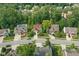 Aerial view of home, showcasing landscaping and neighborhood with mature trees at 10402 Shakamak Way, Indianapolis, IN 46239