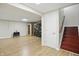 Finished basement with wooden floor offers versatile space for recreation and relaxation at 10402 Shakamak Way, Indianapolis, IN 46239