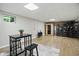 Finished basement with wood flooring, neutral paint, a table with stools, sauna, and cabinet at 10402 Shakamak Way, Indianapolis, IN 46239