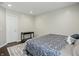 Cozy bedroom with natural light, patterned rug, and dark wood flooring at 10402 Shakamak Way, Indianapolis, IN 46239