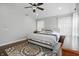 Spacious bedroom features hardwood floors, neutral walls, ceiling fan, and natural light at 10402 Shakamak Way, Indianapolis, IN 46239