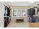 Walk-in closet with window and built-in shelving provides ample storage space at 10402 Shakamak Way, Indianapolis, IN 46239