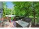 Wooden deck featuring outdoor seating with views of the lush backyard at 10402 Shakamak Way, Indianapolis, IN 46239