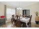 Charming dining room featuring hardwood floors, natural light, and room for elegant dining at 10402 Shakamak Way, Indianapolis, IN 46239