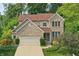 Charming two-story home with brick and siding exterior and well-maintained landscaping at 10402 Shakamak Way, Indianapolis, IN 46239
