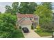 Charming home with a brick facade, attached garage, and landscaped front yard at 10402 Shakamak Way, Indianapolis, IN 46239