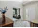 Bright foyer with tiled floor, complemented by an elegant rug and stylish furnishings at 10402 Shakamak Way, Indianapolis, IN 46239