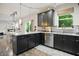 Contemporary kitchen with a window view, sleek cabinets, and stainless steel appliances and fixtures at 10402 Shakamak Way, Indianapolis, IN 46239