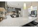 Beautiful kitchen with stainless steel appliances, light countertops, and a breakfast bar at 10402 Shakamak Way, Indianapolis, IN 46239