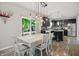 This spacious kitchen features an eat in island, updated stainless steel appliances, and sliding door to the deck at 10402 Shakamak Way, Indianapolis, IN 46239