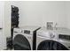 Updated laundry room with stainless steel front loading washer and dryer at 10402 Shakamak Way, Indianapolis, IN 46239
