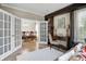 Cozy living room featuring hardwood floors, refined decor, and a view into the dining area at 10402 Shakamak Way, Indianapolis, IN 46239
