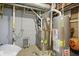 Utility room with water heater, furnace, and assorted hardware at 10402 Shakamak Way, Indianapolis, IN 46239