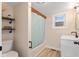 Bathroom with modern fixtures, including vanity, toilet, and tub with patterned shower curtain at 106 N Blake St, Sheridan, IN 46069