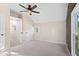 Bedroom features neutral carpet, light walls, window and closet with ceiling fan at 106 N Blake St, Sheridan, IN 46069
