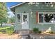 Inviting front door entrance with a small set of steps and landscaped garden bed at 106 N Blake St, Sheridan, IN 46069