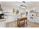 Bright kitchen with white cabinetry, subway tile backsplash, wood countertops and island at 106 N Blake St, Sheridan, IN 46069