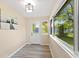 Bright mud room featuring large windows, a door to the exterior, and fresh paint at 106 N Blake St, Sheridan, IN 46069