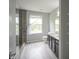 Bathroom showcasing a tiled shower, and double vanity at 10903 Greenleaf Dr, Indianapolis, IN 46229