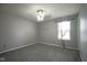 Neutral bedroom with carpet flooring, ceiling fan, and natural light from window at 10903 Greenleaf Dr, Indianapolis, IN 46229