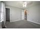 Bedroom showcasing carpet, ceiling fan, and access to a walk-in closet and bathroom at 10903 Greenleaf Dr, Indianapolis, IN 46229