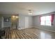 Bright bedroom features wood-look flooring, neutral walls, and a ceiling fan at 10903 Greenleaf Dr, Indianapolis, IN 46229