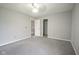 Spacious bedroom with carpet flooring, ceiling fan, and access to closet and bathroom at 10903 Greenleaf Dr, Indianapolis, IN 46229