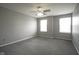 Large bedroom with two windows providing ample natural light and neutral carpet flooring at 10903 Greenleaf Dr, Indianapolis, IN 46229