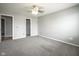 Bright bedroom with two closets, carpet flooring, and a modern ceiling fan at 10903 Greenleaf Dr, Indianapolis, IN 46229