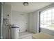 Functional laundry room with a utility sink and large window at 10903 Greenleaf Dr, Indianapolis, IN 46229