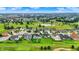Aerial view of a beautiful golf course community featuring ponds, lush landscaping, and diverse home designs at 1135 Maclaren Ct, Franklin, IN 46131