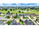 An aerial view of a well-planned golf community, featuring upscale homes, lush greenery, and a scenic golf course at 1135 Maclaren Ct, Franklin, IN 46131