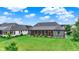 Grassy backyard featuring a screened-in porch, providing a perfect setting for relaxation at 1135 Maclaren Ct, Franklin, IN 46131