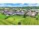 Lush green backyard with mature trees and well-maintained lawns, perfect for outdoor enjoyment and relaxation at 1135 Maclaren Ct, Franklin, IN 46131