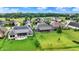 Expansive backyard with lush green grass and elegant homes, creating a serene outdoor living space at 1135 Maclaren Ct, Franklin, IN 46131