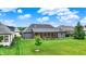 Expansive backyard featuring a screened-in porch and verdant lawn, perfect for outdoor living at 1135 Maclaren Ct, Franklin, IN 46131