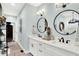 Stylish bathroom with double sinks, modern lighting, and sleek fixtures at 1135 Maclaren Ct, Franklin, IN 46131