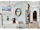 Bright bathroom featuring a modern soaking tub, decorative chair, and stylish round mirror at 1135 Maclaren Ct, Franklin, IN 46131