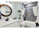 Charming bathroom featuring a modern vanity, round mirror, and tiled shower with curtain at 1135 Maclaren Ct, Franklin, IN 46131