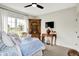 Comfortable bedroom with a decorative bed, wooden furnishings, and great natural light at 1135 Maclaren Ct, Franklin, IN 46131