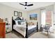 Relaxing bedroom with a black bed, soft white bedding and lots of light from the surrounding windows at 1135 Maclaren Ct, Franklin, IN 46131
