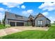 Charming exterior with a gray facade, a two-car garage, and a beautifully manicured lawn at 1135 Maclaren Ct, Franklin, IN 46131