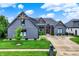 Charming home boasts fresh landscaping, craftsman details, and a well-maintained lawn enhancing its curb appeal at 1135 Maclaren Ct, Franklin, IN 46131