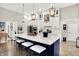 Spacious kitchen featuring a large island with seating, modern appliances, and ample counter space for cooking at 1135 Maclaren Ct, Franklin, IN 46131