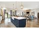 Bright, open-concept kitchen and living space, with a large island, and barstool seating at 1135 Maclaren Ct, Franklin, IN 46131